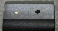 The polyamide surface on the right shows the freshly applied drops of plasma indicator metal compound.
 On the left, the pure gold-coloured metal after plasma treatment can be seen.
